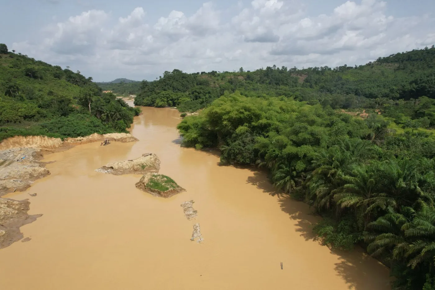 Drone view of the Ankobra River between forested banks.